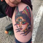woman with third eye and butterfly wings tattoo